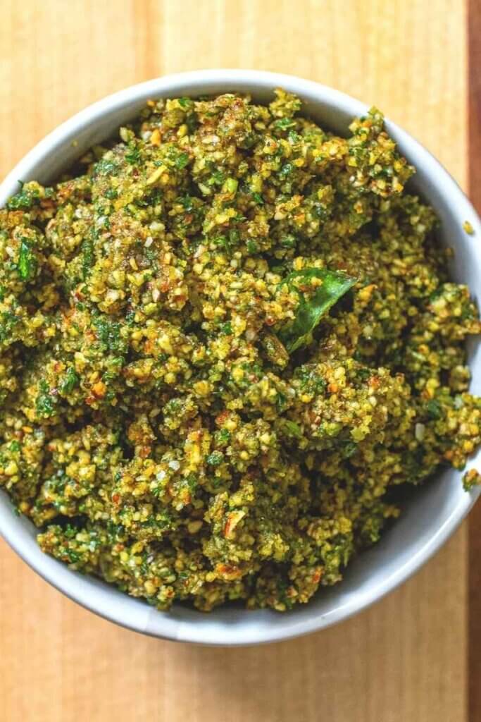 top shot of vegan almond pesto in a white bowl
