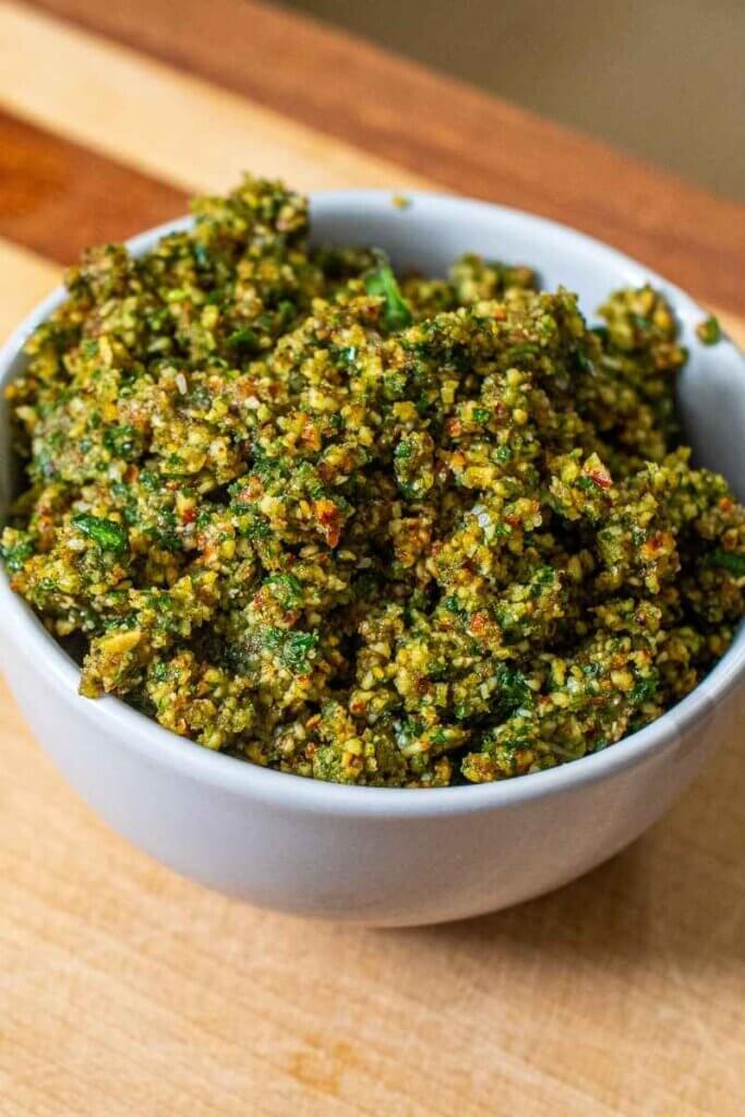 dairy free almond pesto in a white bowl