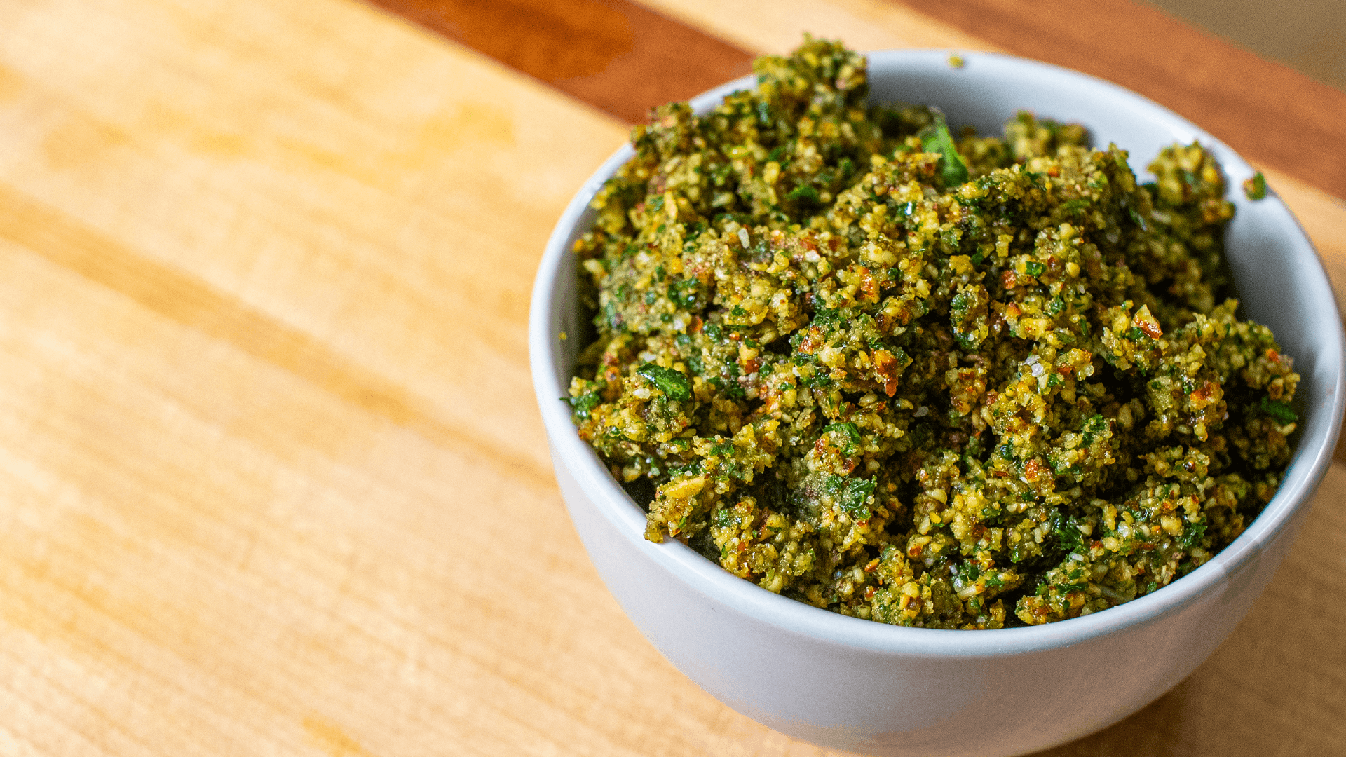 site shot of almond pesto in a small white bowl