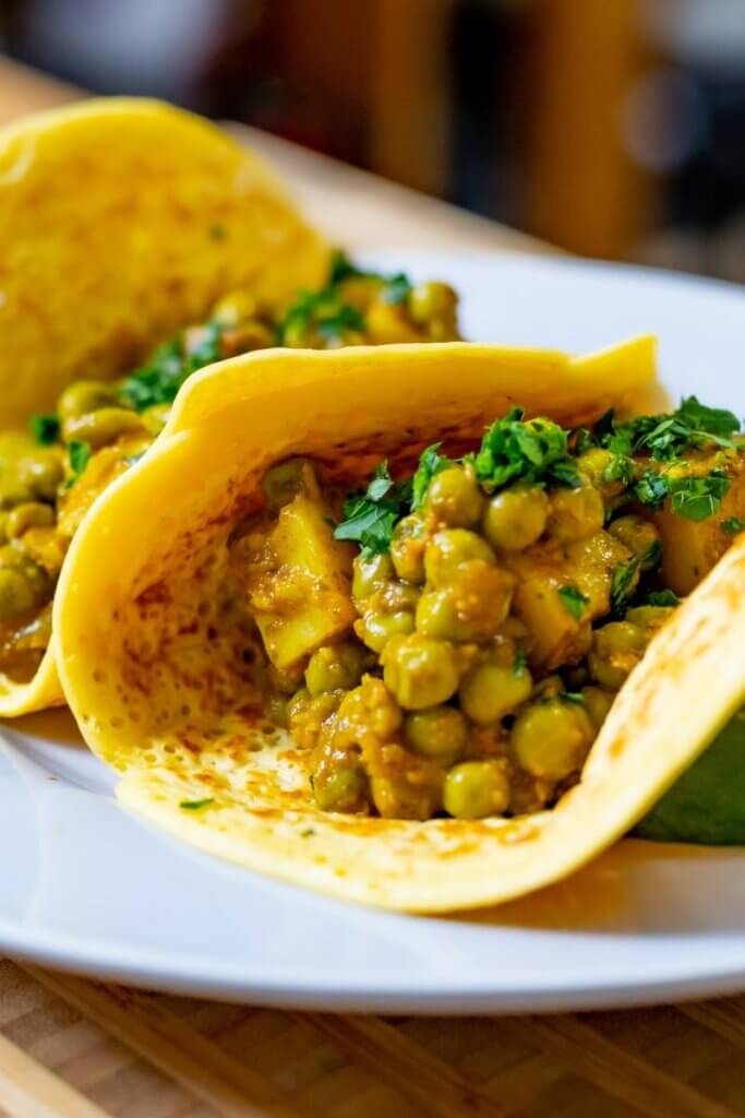 chickpea tortillas filled with cooked veggies