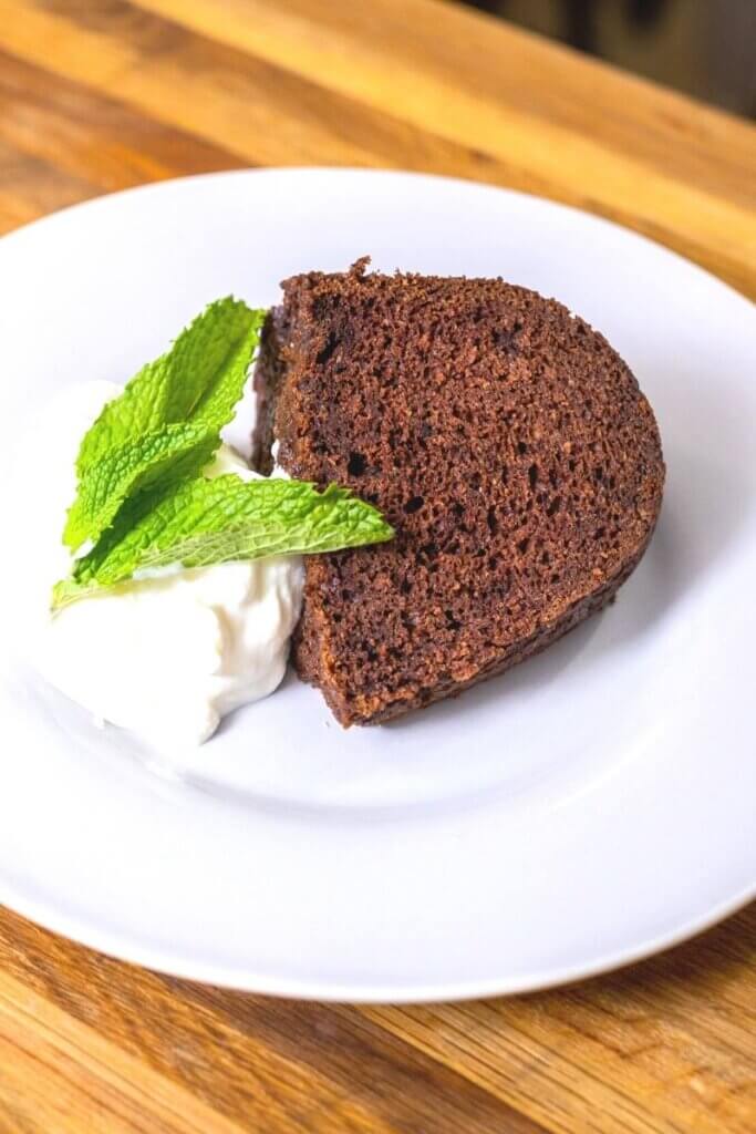 chocolate orange cake slice on a small white plate