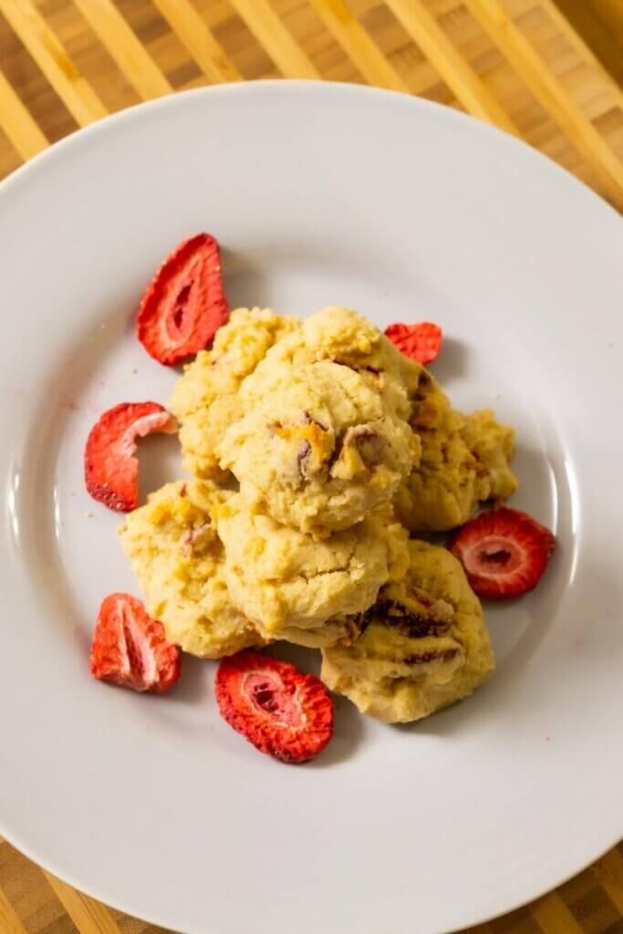top view of strawberry cream cheese cookies on a white plate