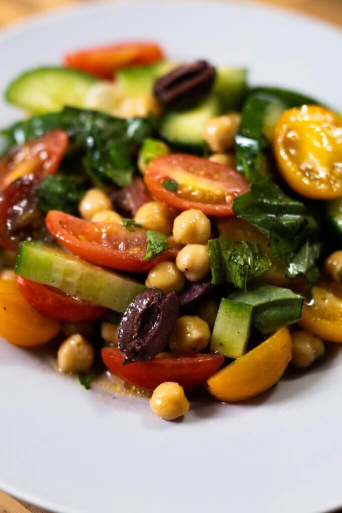 Mediterranean cucumber salad in a large white bowl.