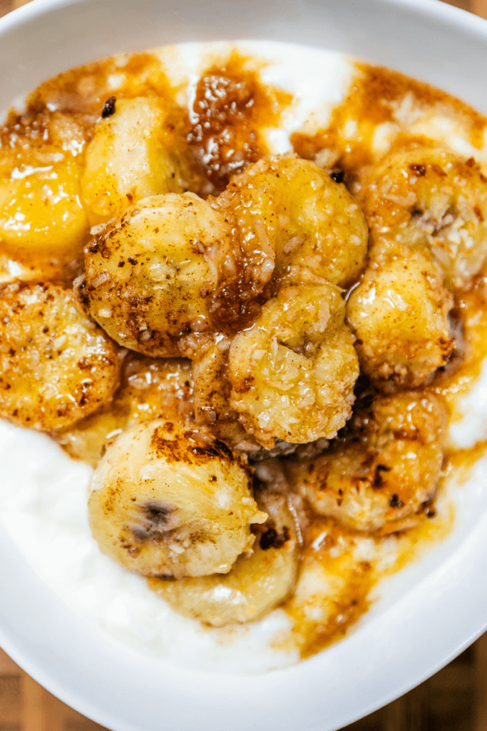 Top view of baked bananas in a bowl. 