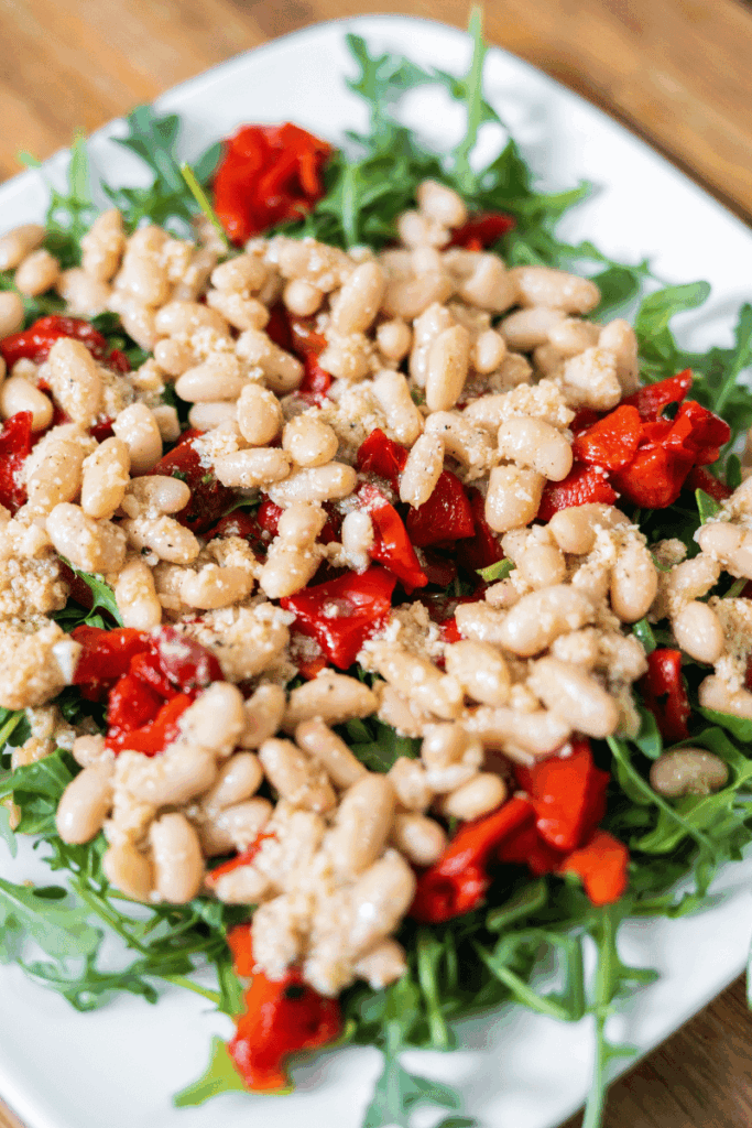 Homemade roasted bell pepper salad on a white plate.