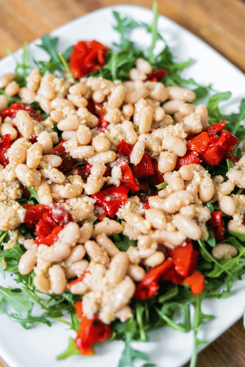 Homemade roasted bell pepper salad on a white plate.