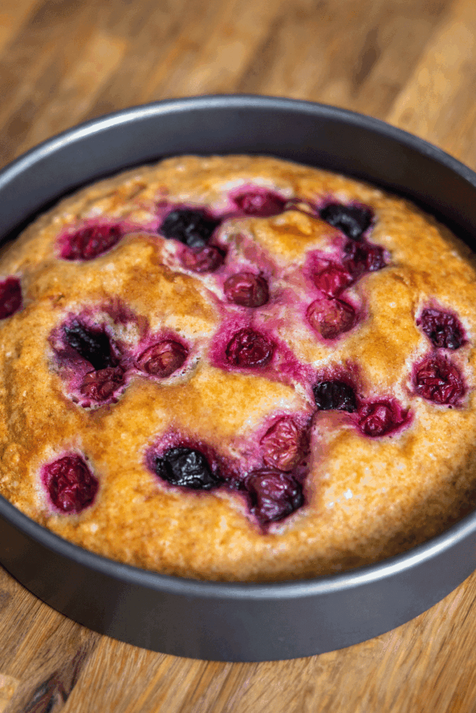 Sour cherry cake cooling in a baking pan. 